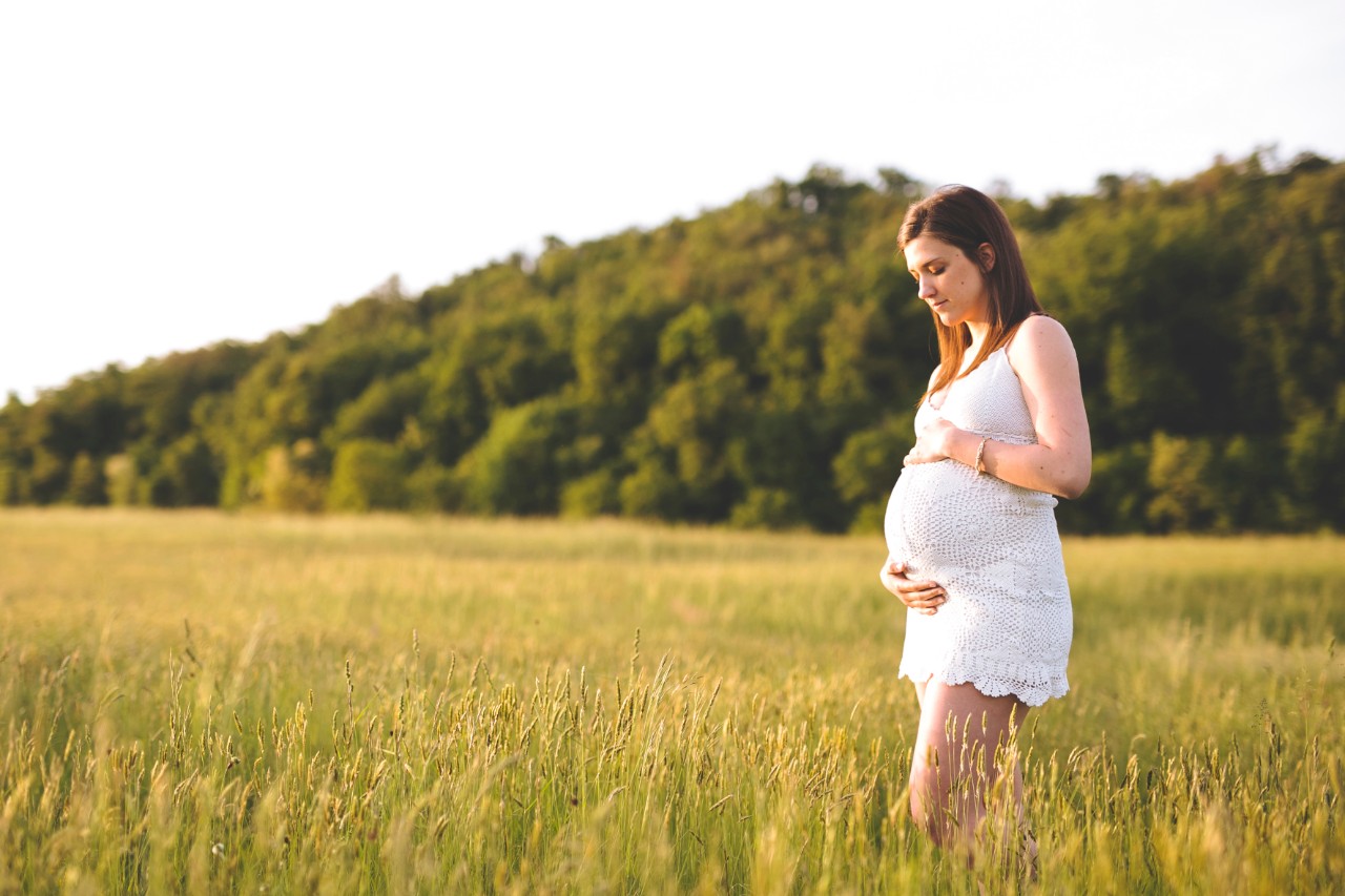 pregnant woman in open field